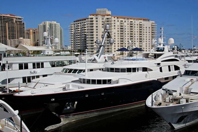 a large white boat in a harbor aboard NEXT CHAPTER Yacht for Sale