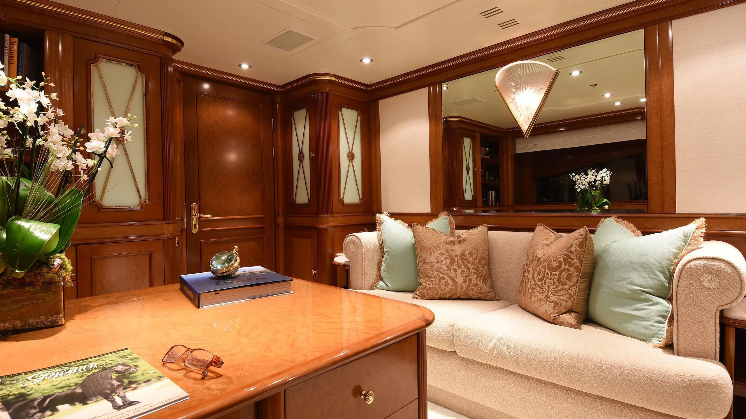 a living room with a white couch aboard NEXT CHAPTER Yacht for Sale