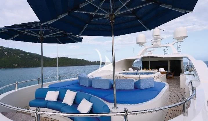 a pool with umbrellas aboard NEXT CHAPTER Yacht for Sale