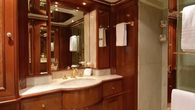 a bathroom with a large mirror aboard NEXT CHAPTER Yacht for Sale