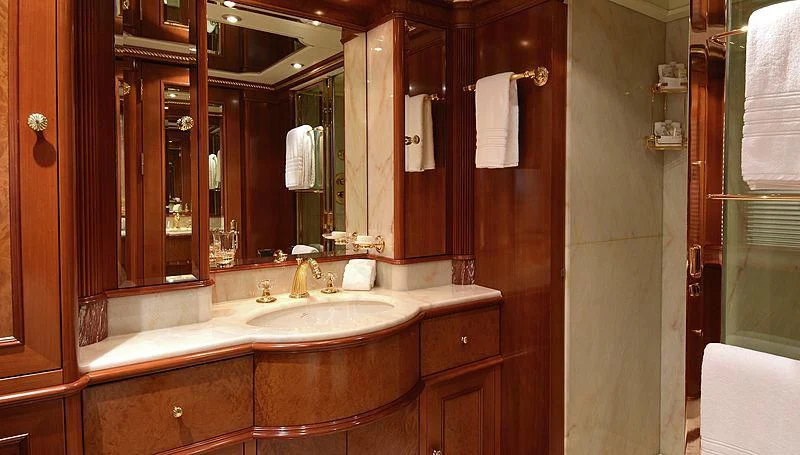 a bathroom with a sink and a mirror aboard NEXT CHAPTER Yacht for Sale