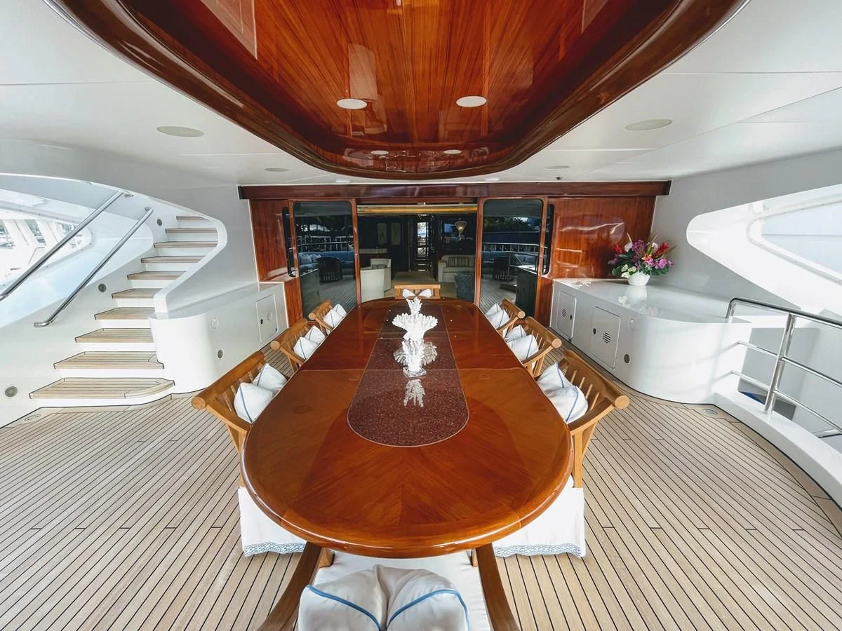a modern looking kitchen with a dining table and chairs aboard NEXT CHAPTER Yacht for Sale