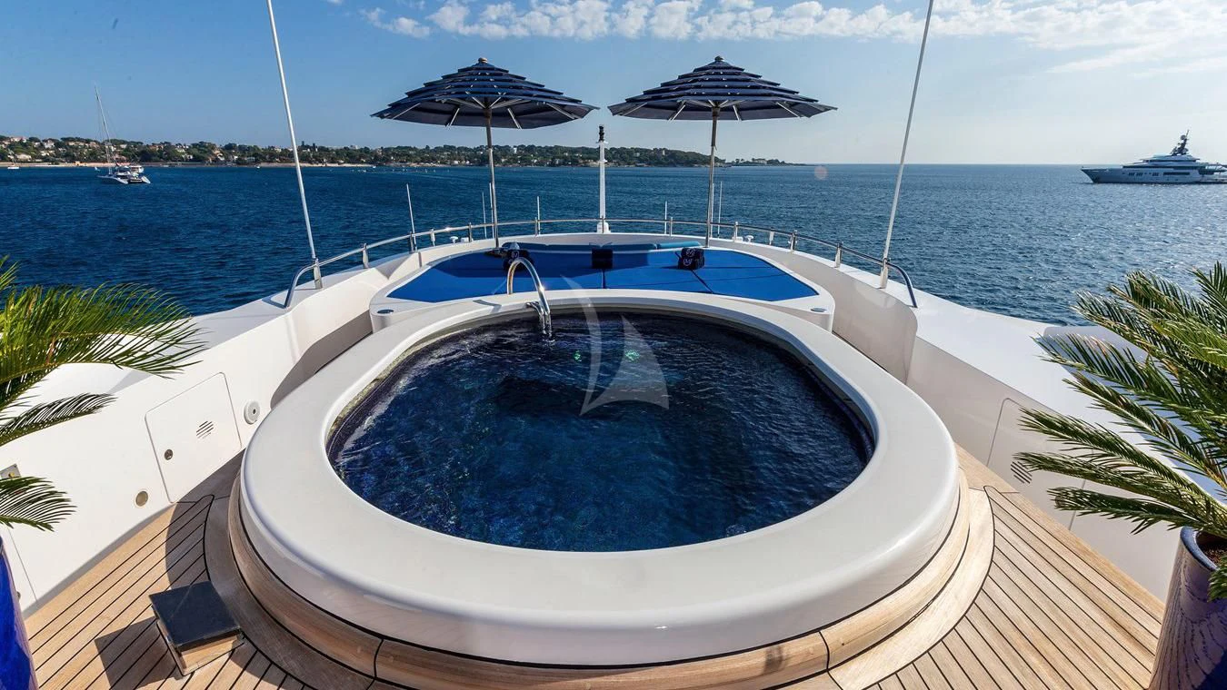 a swimming pool on a deck aboard NEXT CHAPTER Yacht for Sale