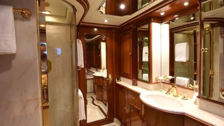 a bathroom with a large mirror aboard NEXT CHAPTER Yacht for Sale