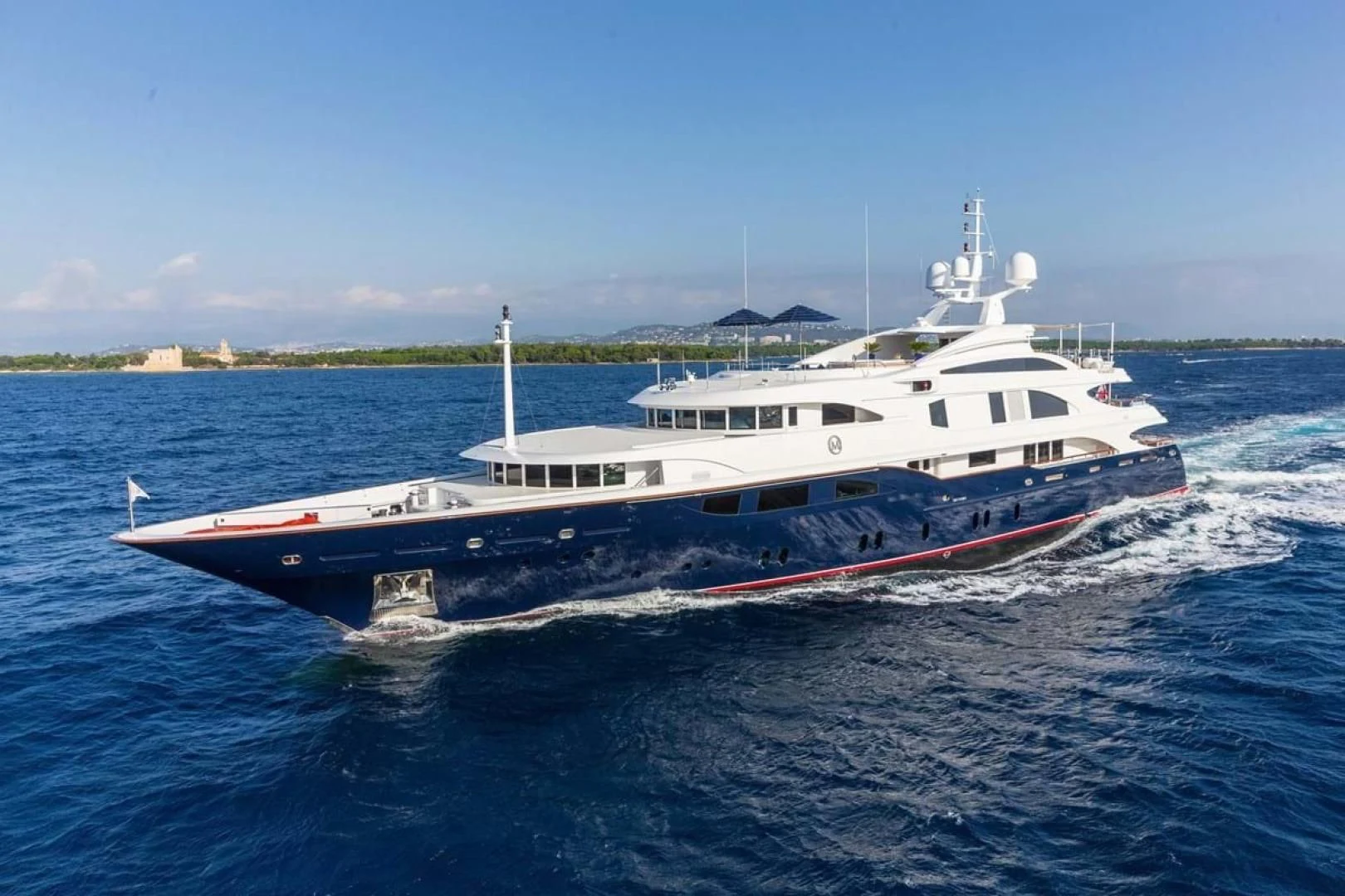 a large white boat on the water aboard NEXT CHAPTER Yacht for Sale