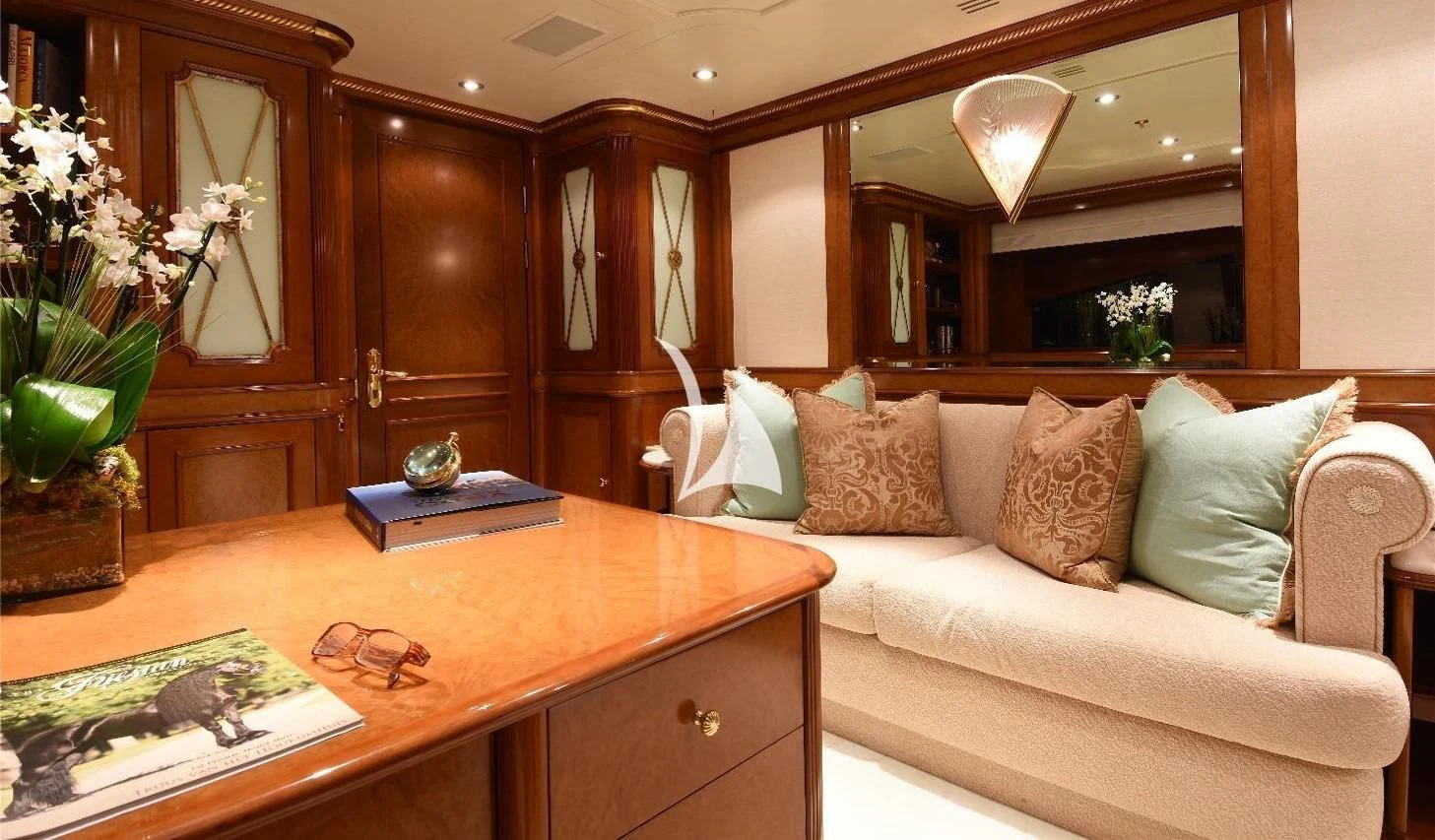 a living room with a couch and a coffee table aboard NEXT CHAPTER Yacht for Sale
