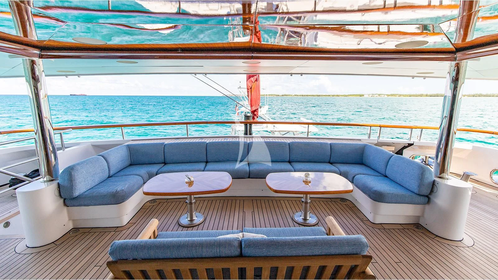 a room with a couch and a table and a view of the ocean aboard NEXT CHAPTER Yacht for Sale