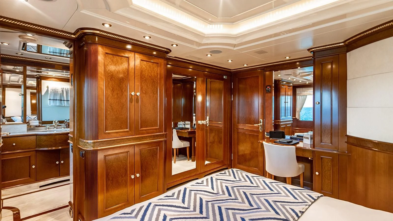 a bedroom with a bed and cabinets aboard NEXT CHAPTER Yacht for Sale