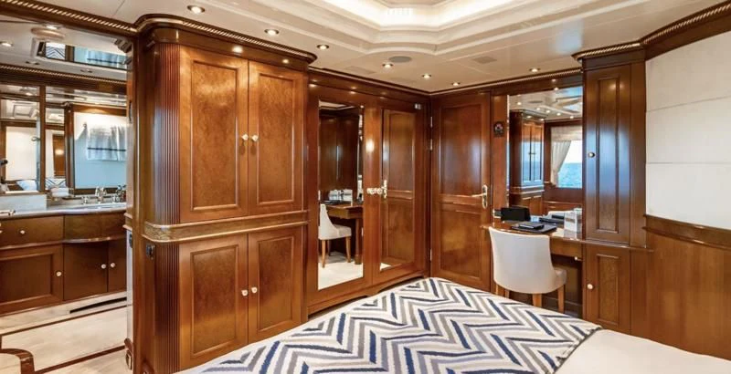 a room with a bed and cabinets aboard NEXT CHAPTER Yacht for Sale
