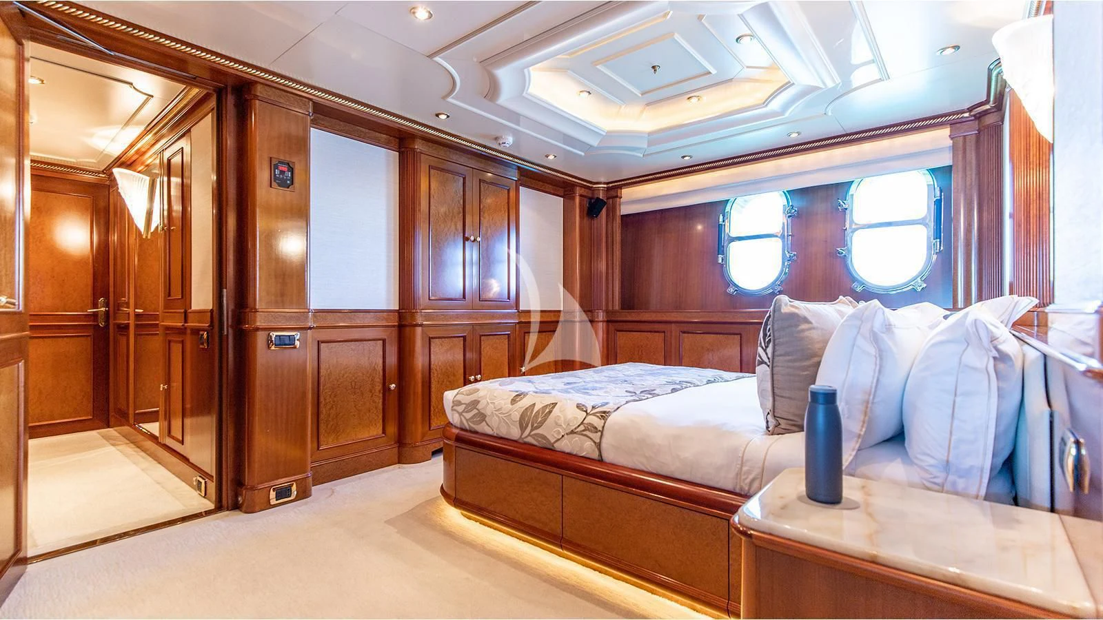 a person sitting on a bed aboard NEXT CHAPTER Yacht for Sale