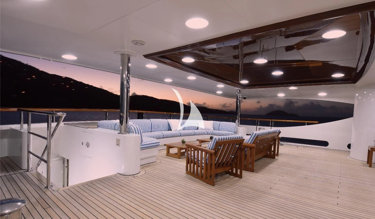 a room with tables and chairs aboard NEXT CHAPTER Yacht for Sale