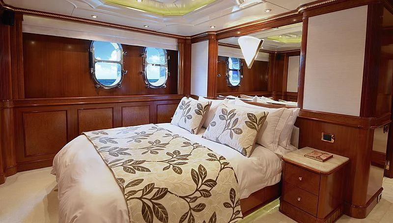 a room with a bed and a window aboard NEXT CHAPTER Yacht for Sale