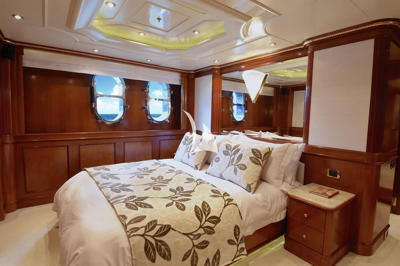 a bed with a white comforter aboard NEXT CHAPTER Yacht for Sale