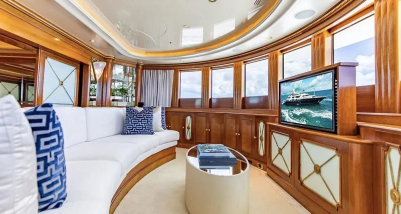 a room with a couch and a television aboard NEXT CHAPTER Yacht for Sale