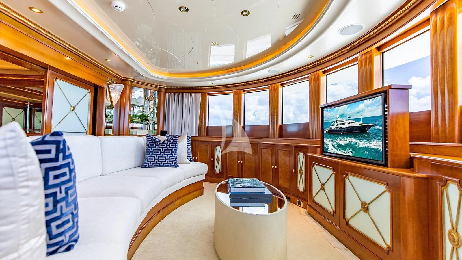 a room with a couch and a television aboard NEXT CHAPTER Yacht for Sale
