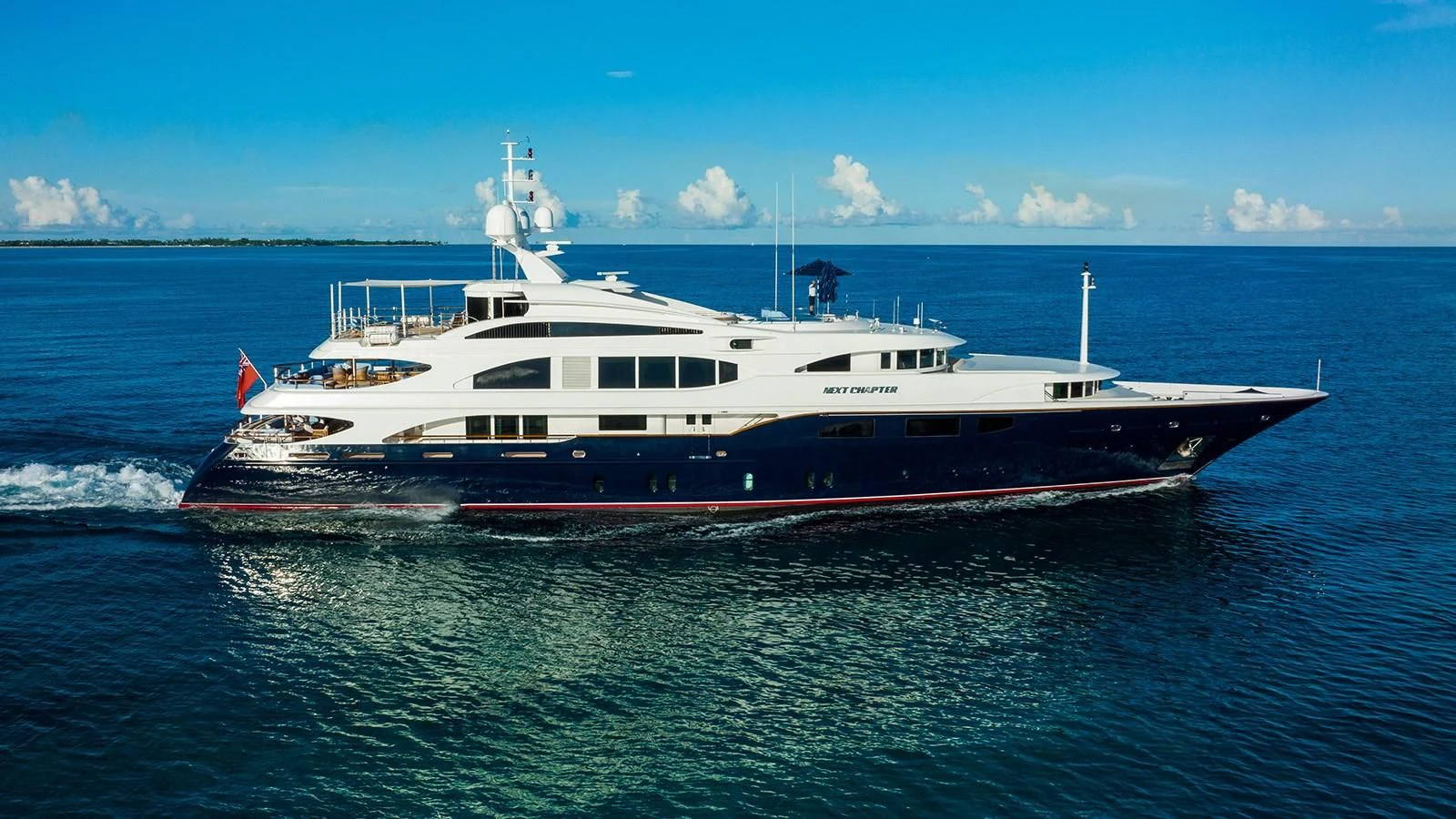 a large white boat in the water aboard NEXT CHAPTER Yacht for Sale