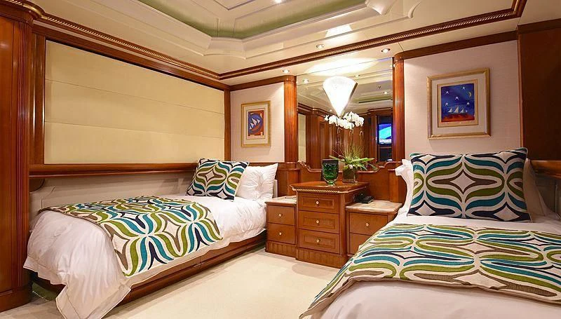 a bedroom with two beds aboard NEXT CHAPTER Yacht for Sale