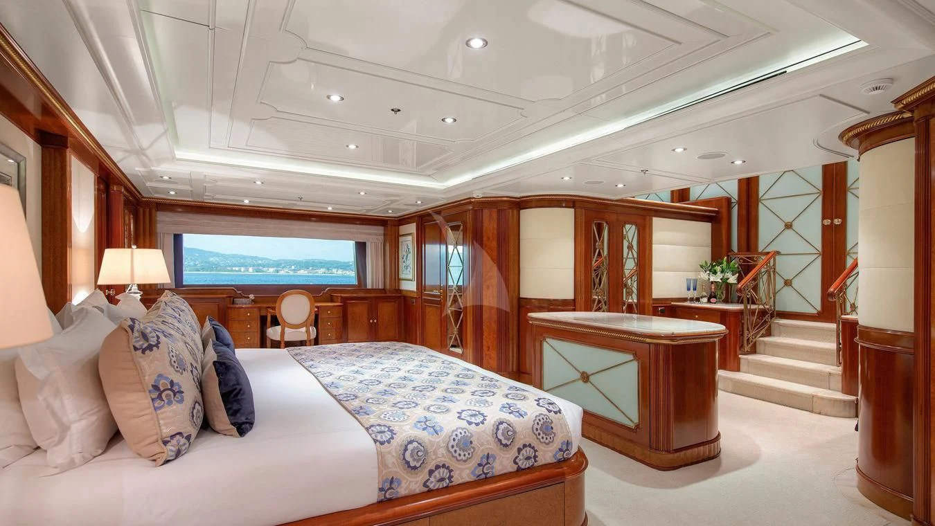a room with a bed and a desk aboard NEXT CHAPTER Yacht for Sale