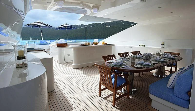 a room with a table and chairs aboard NEXT CHAPTER Yacht for Sale