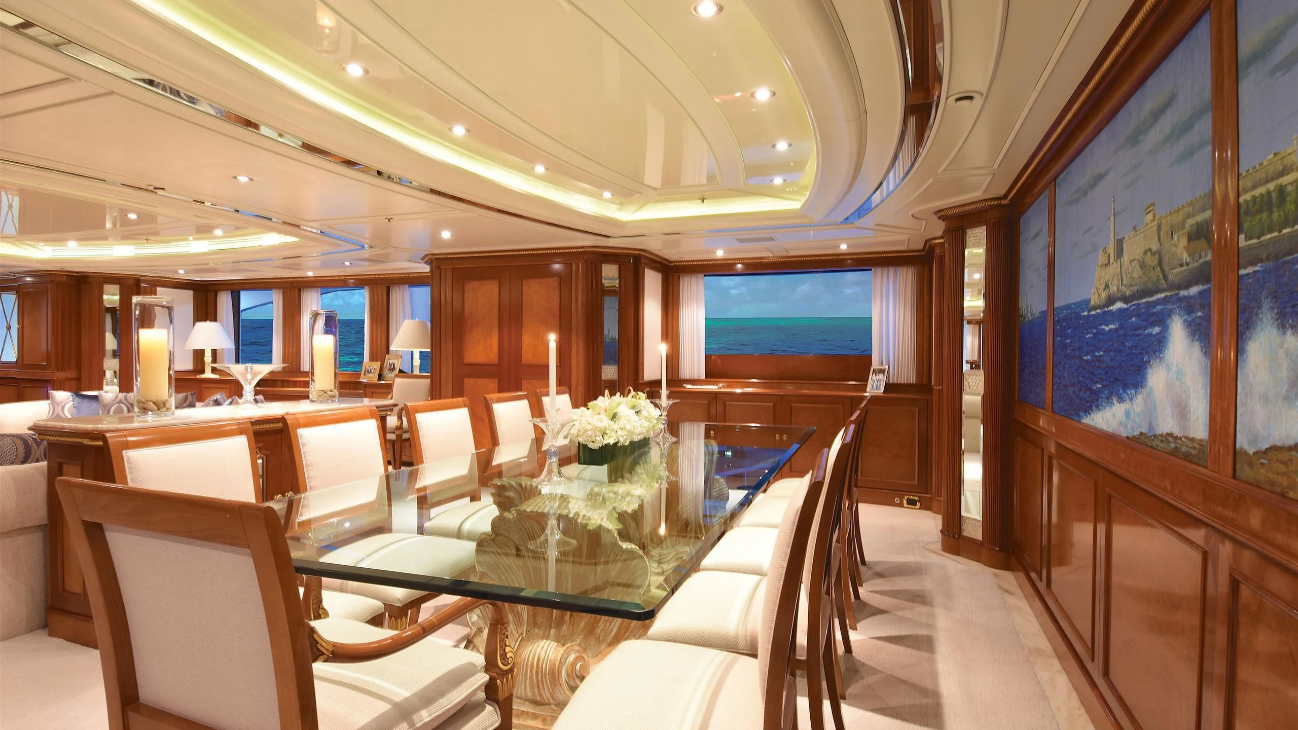 a room with a table chairs and a large window aboard NEXT CHAPTER Yacht for Sale