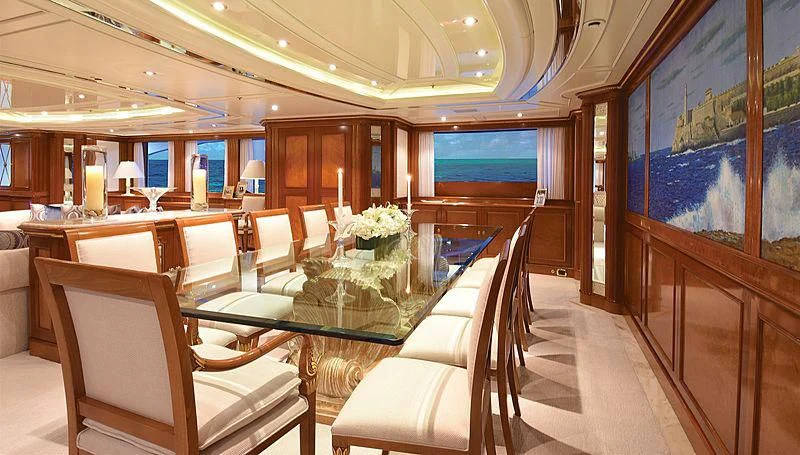 a room with a table chairs and a large window aboard NEXT CHAPTER Yacht for Sale