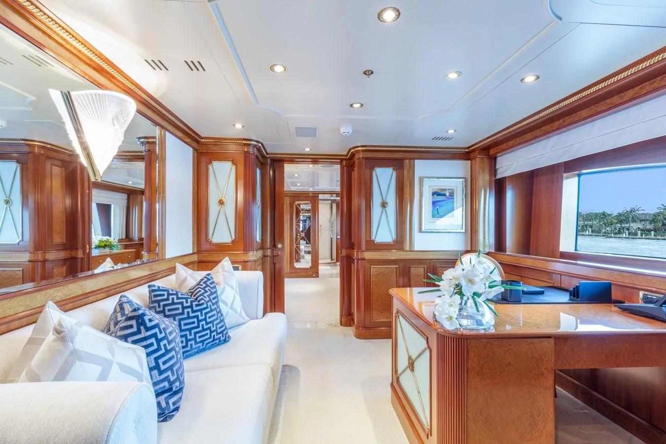 a room with a bed and desk aboard NEXT CHAPTER Yacht for Sale
