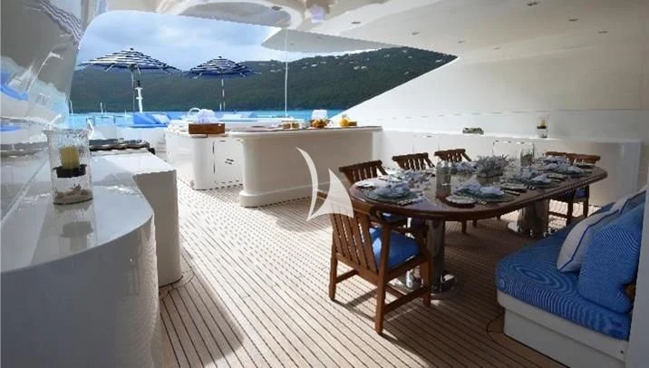 a room with a table and chairs aboard NEXT CHAPTER Yacht for Sale