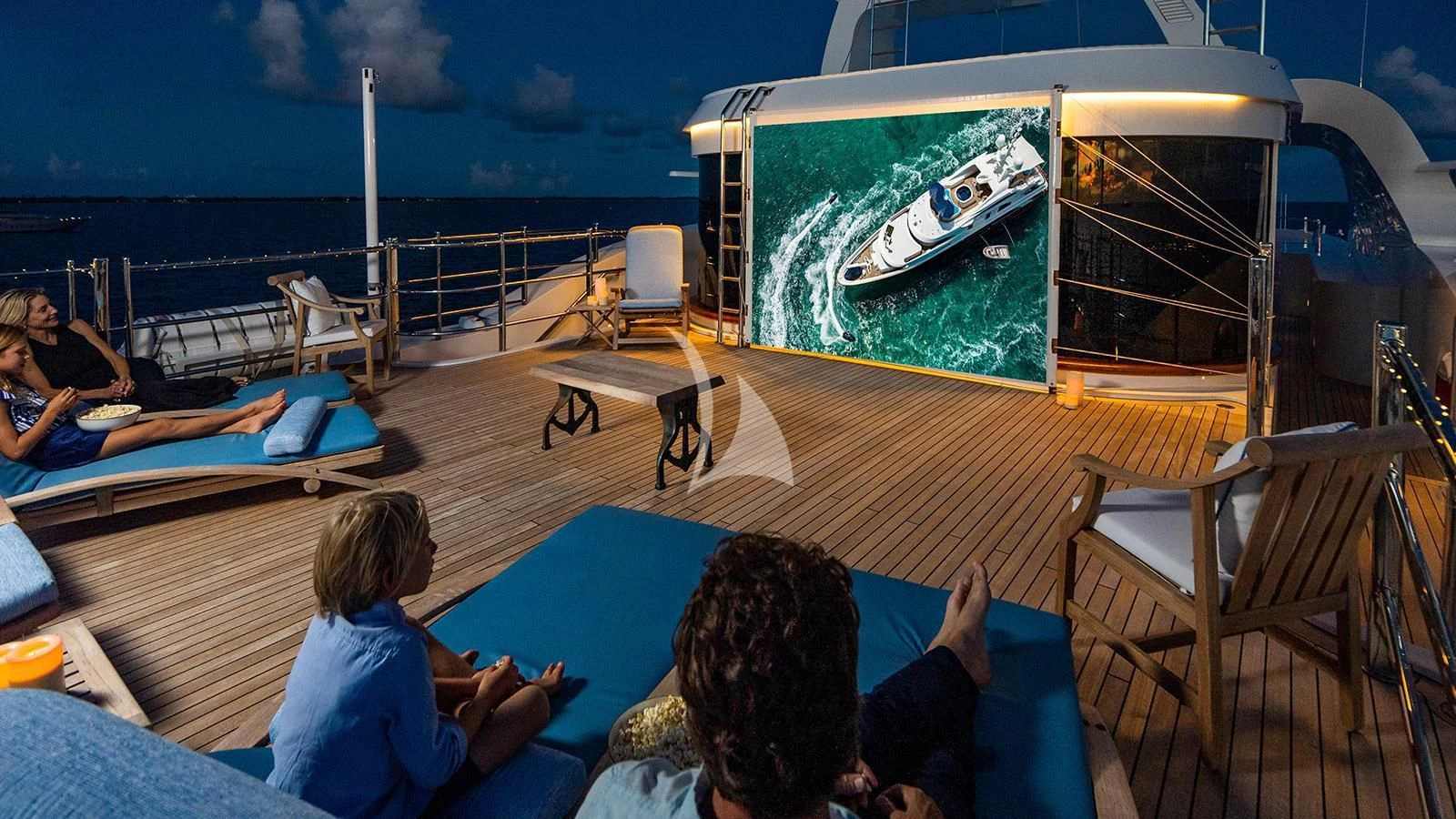 people sitting on a deck aboard NEXT CHAPTER Yacht for Sale
