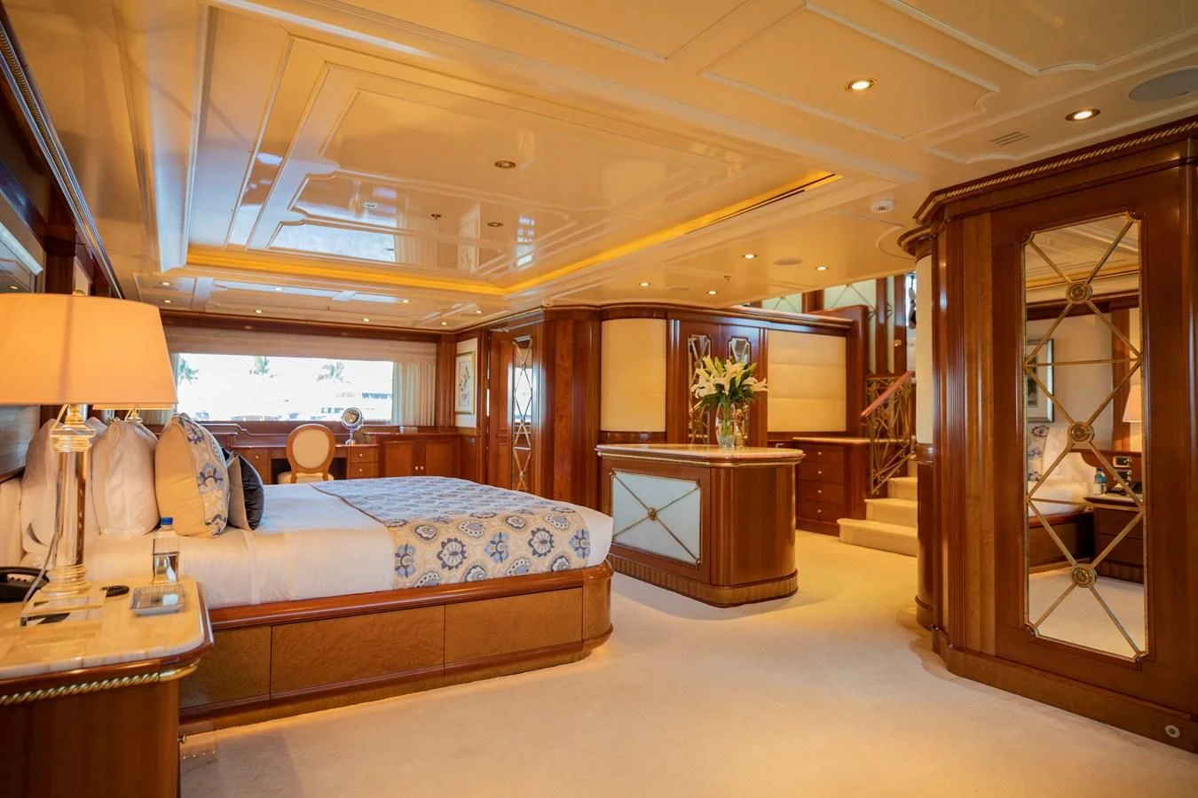 a room with a bed and a desk aboard NEXT CHAPTER Yacht for Sale