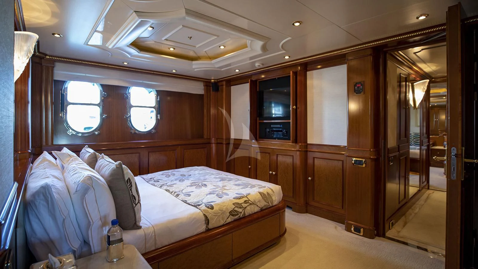 a room with a bed and a glass door aboard NEXT CHAPTER Yacht for Sale