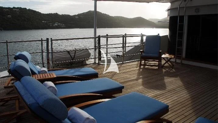 a deck with chairs and a stuffed toy on it aboard NEXT CHAPTER Yacht for Sale