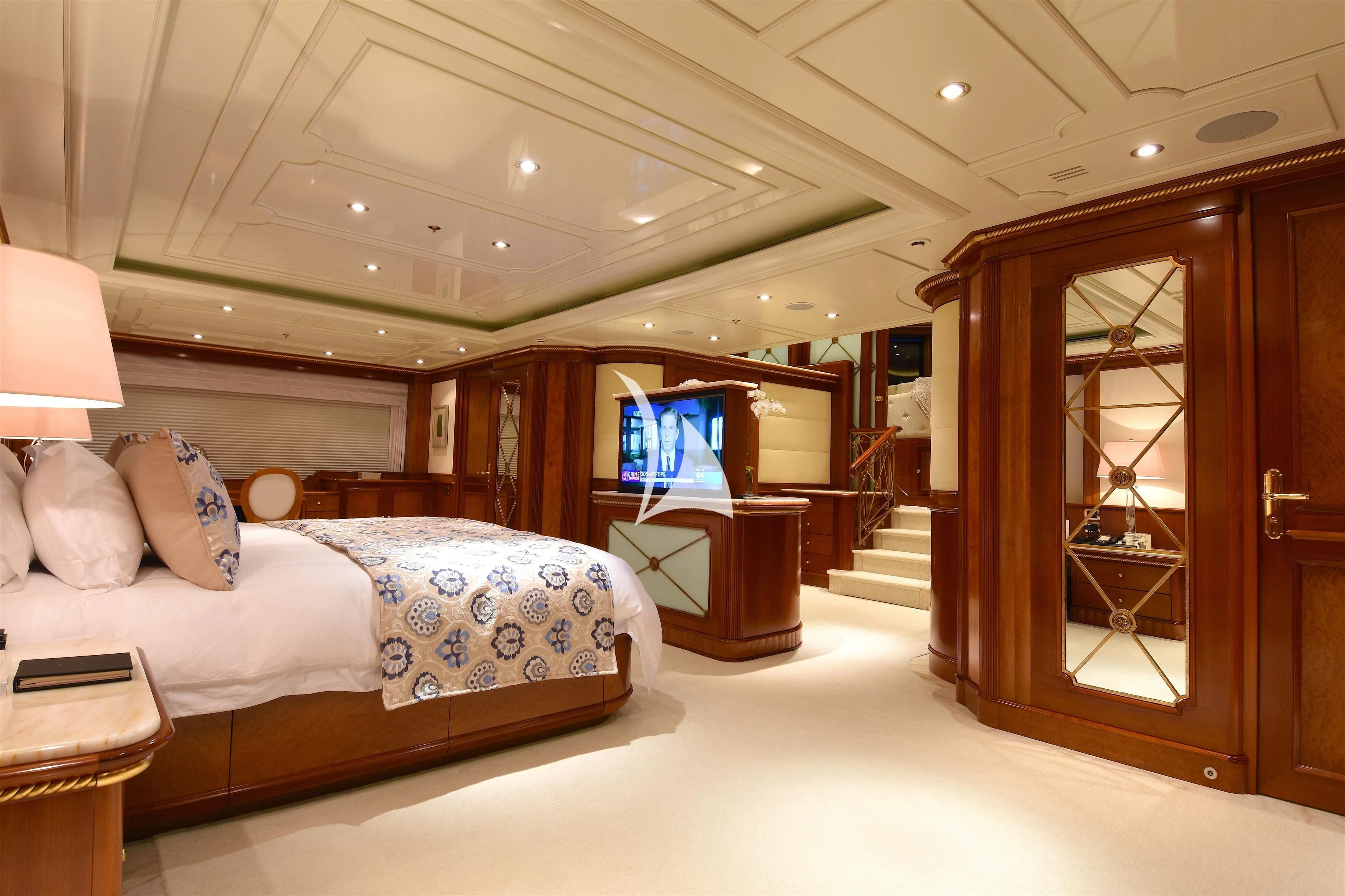 a bedroom with a bed and a tv aboard NEXT CHAPTER Yacht for Sale