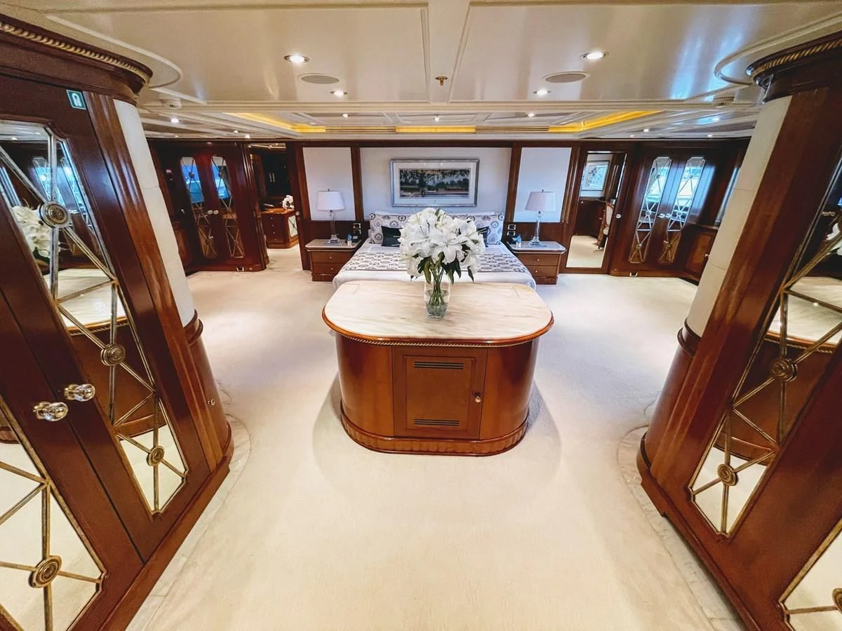 a room with a table and chairs aboard NEXT CHAPTER Yacht for Sale