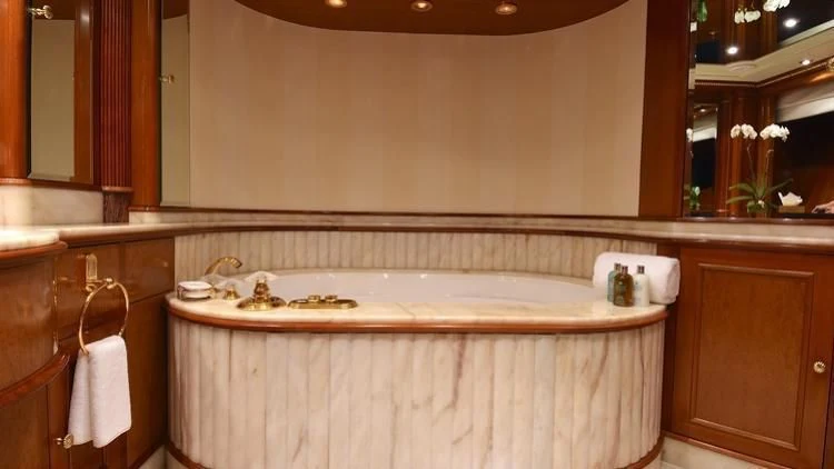 a bathroom with a bathtub and sink aboard NEXT CHAPTER Yacht for Sale