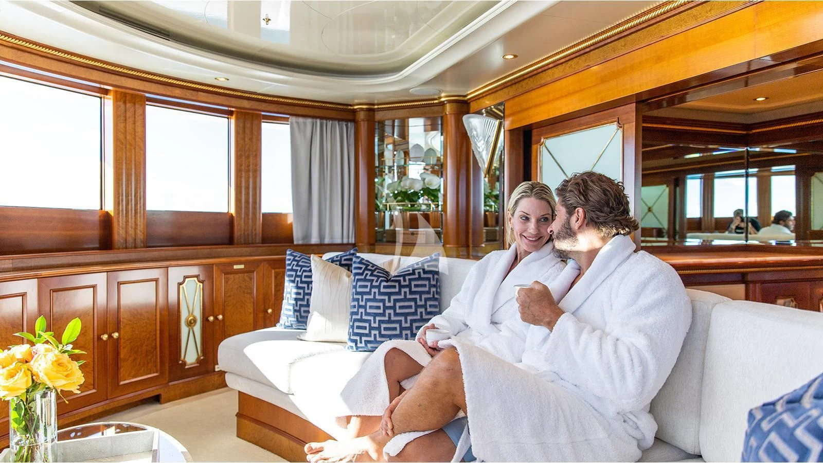 a man and a woman sitting on a couch aboard NEXT CHAPTER Yacht for Sale
