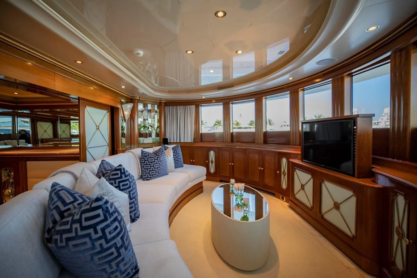 a living room with a large mirror aboard NEXT CHAPTER Yacht for Sale