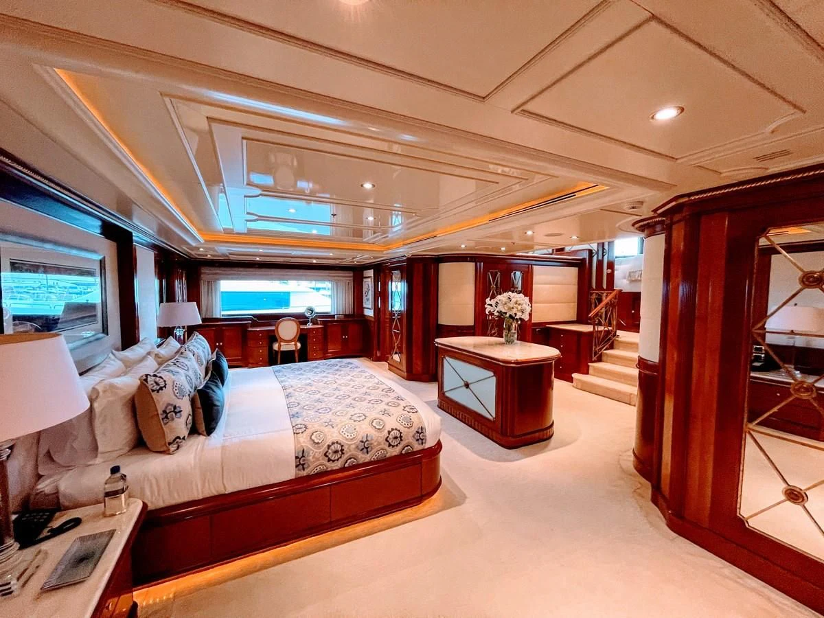 a room with a bed and a table aboard NEXT CHAPTER Yacht for Sale