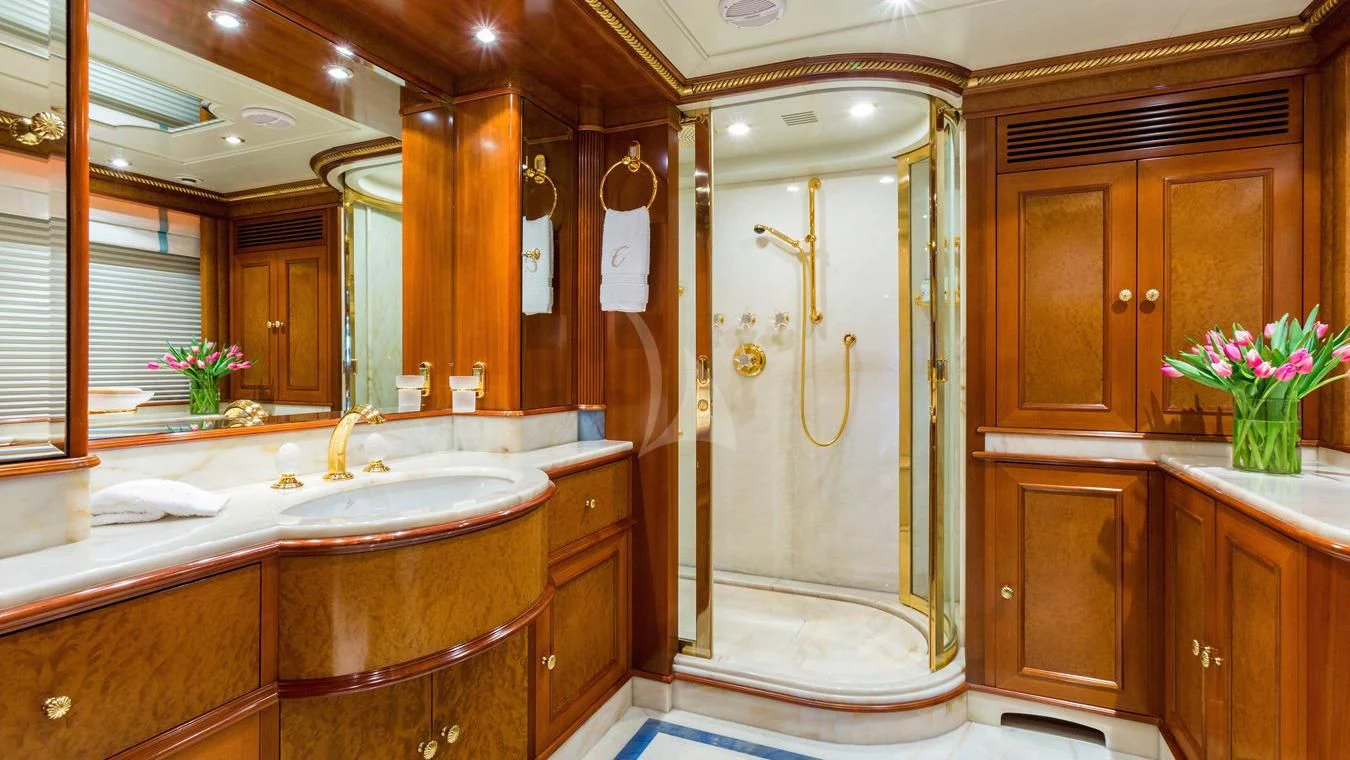 a bathroom with a shower and sink aboard NEXT CHAPTER Yacht for Sale