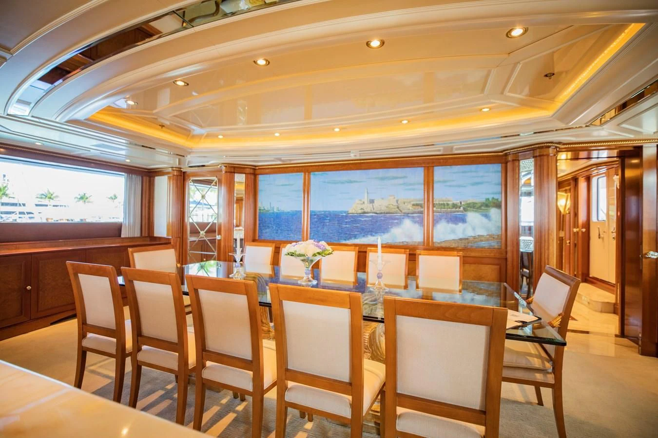 a room with tables and chairs aboard NEXT CHAPTER Yacht for Sale