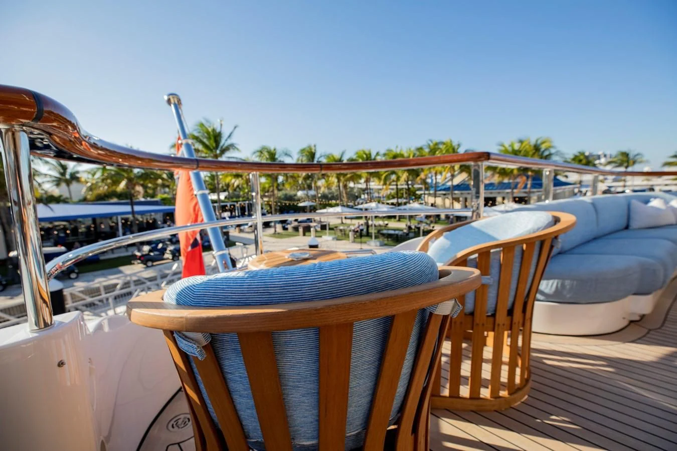 a deck with chairs and a table aboard NEXT CHAPTER Yacht for Sale
