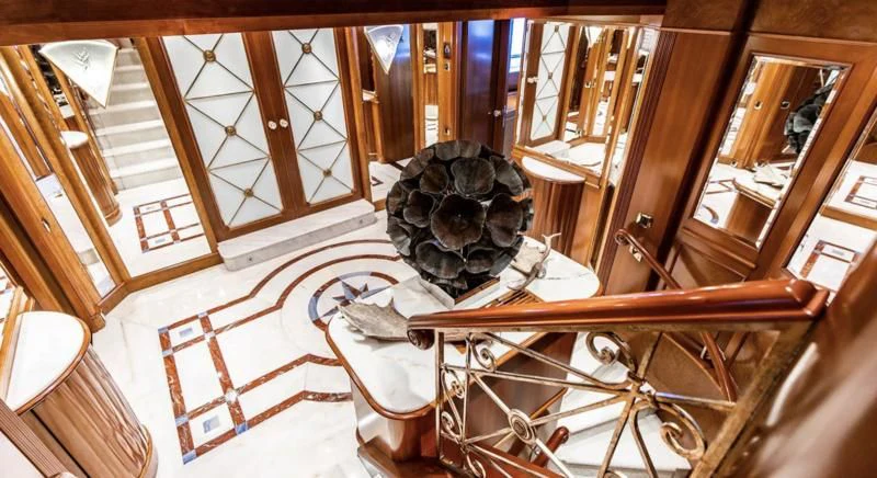a room with a large chandelier and a large chandelier aboard NEXT CHAPTER Yacht for Sale