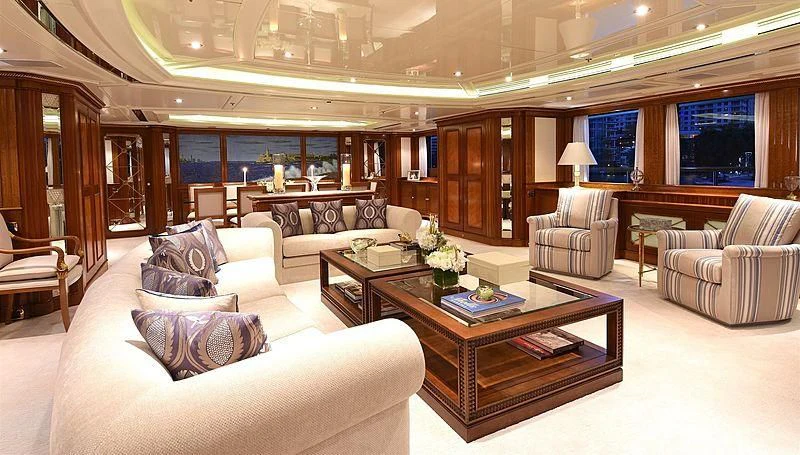 a living room with a table and chairs aboard NEXT CHAPTER Yacht for Sale