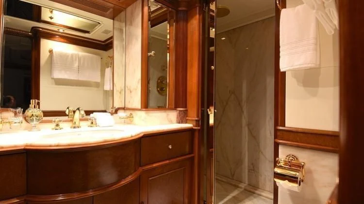 a bathroom with a sink and a mirror aboard NEXT CHAPTER Yacht for Sale