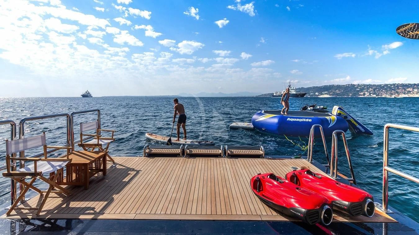 a couple of people on a dock aboard NEXT CHAPTER Yacht for Sale