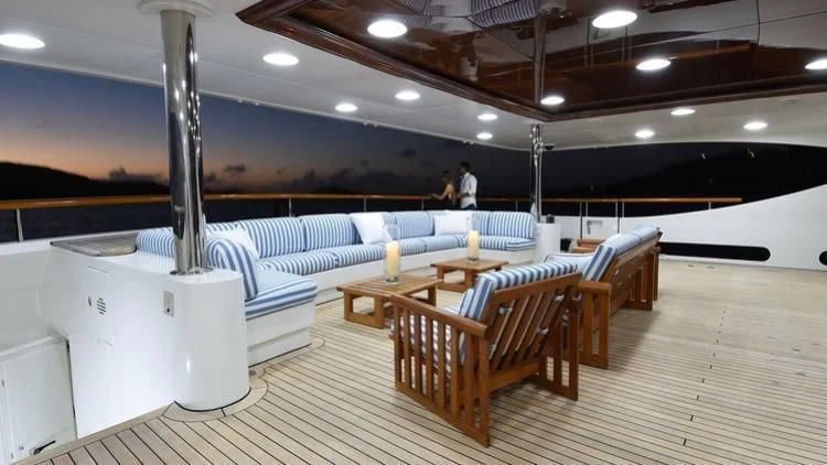a large room with a large white table and chairs aboard NEXT CHAPTER Yacht for Sale