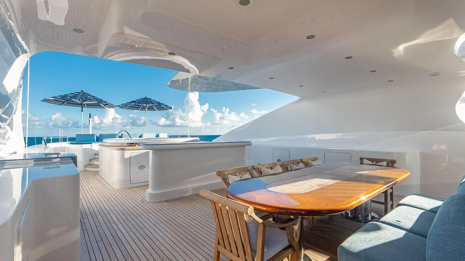 a room with a table and chairs aboard NEXT CHAPTER Yacht for Sale