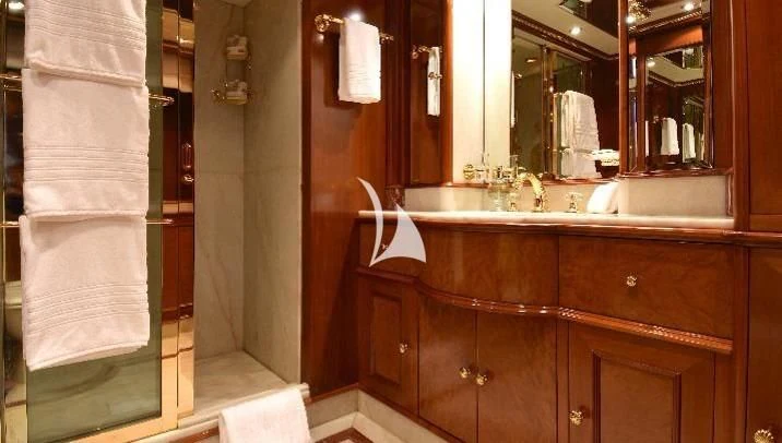 a bathroom with a sink and towels aboard NEXT CHAPTER Yacht for Sale