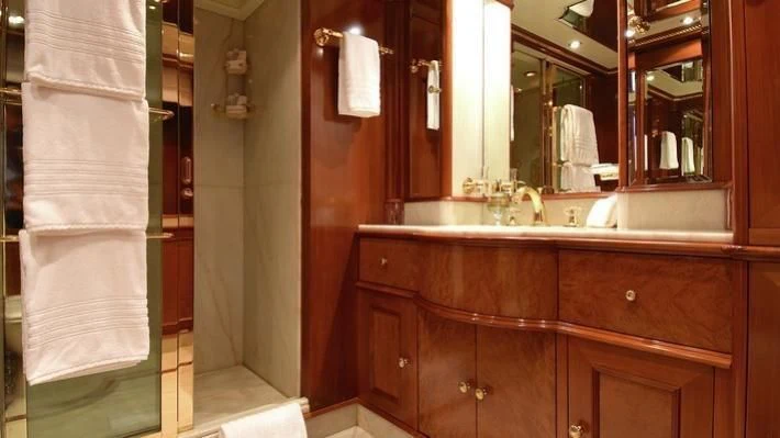 a bathroom with a sink and a mirror aboard NEXT CHAPTER Yacht for Sale