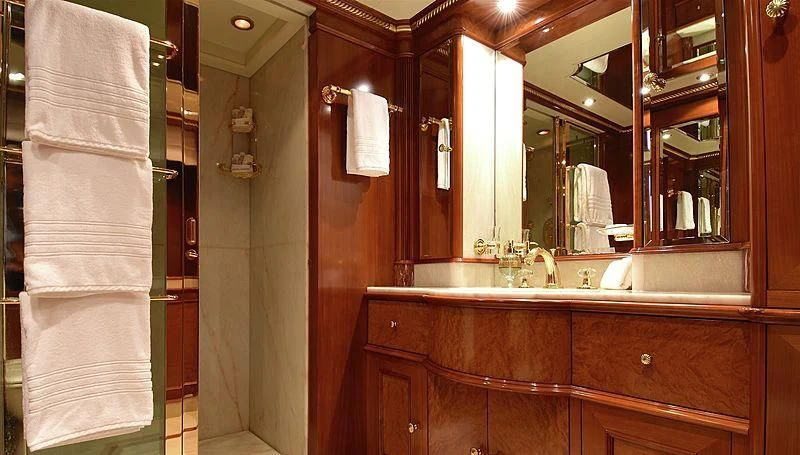 a bathroom with a sink and towels aboard NEXT CHAPTER Yacht for Sale