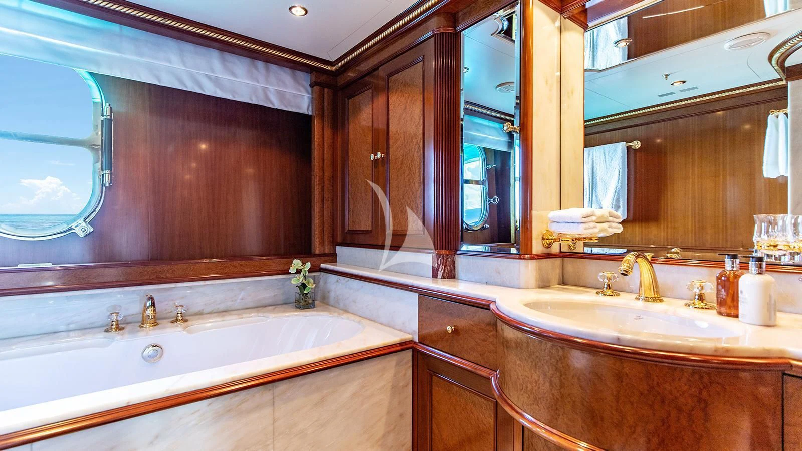 a bathroom with a large mirror aboard NEXT CHAPTER Yacht for Sale
